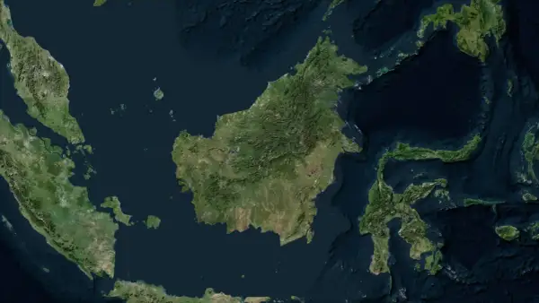Widok satelitarny Borneo, z zaznaczonymi terenami zielonymi i wodami. Widać fragmenty Malezji i Indonezji, idealne do planowania podróży, w tym lotnisko na Borneo.